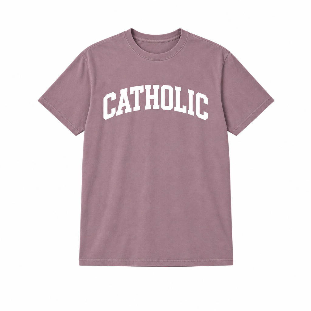 White CATHOLIC lettering on a mauve shirt